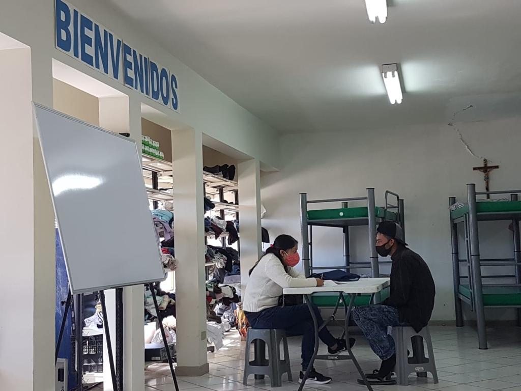 A migrant is interviewed by a BUAP team member in a migrant shelter in Caborca, Sonora.